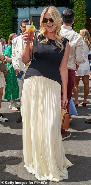 She sipped on a Pimm's while posing for pictures before joining fellow celebs on Centre Court