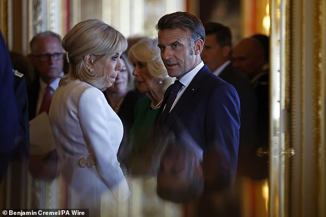 Ms Macron appeared tense during a visit to view the Royal Collection exhibition, in the Green Drawing Room at Windsor Castle on the first day of their State visit (pictured)