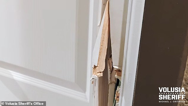 The door had large chunks of splintered wood and the lock and doorknob was entirely busted off.