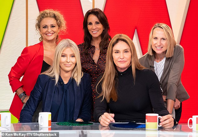 The mother-of-two pictured (centre) alongside the cast of Loose Women and Caitlyn Jenner in 2018