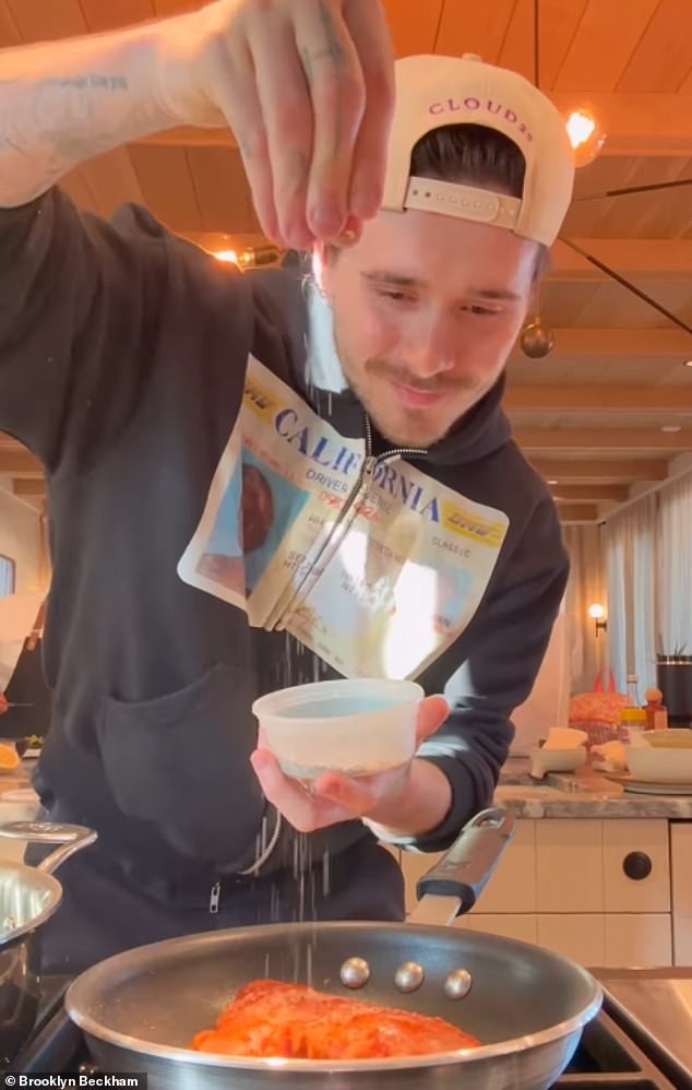 In the clip, Brooklyn was wearing a Whitney Houston drivers license hoodie and a backwards baseball cap, from his hot sauce brand Cloud23