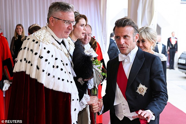 Pictured, the Lord Mayor of the City of London chatting with French President Emmanuel Macron for the evening