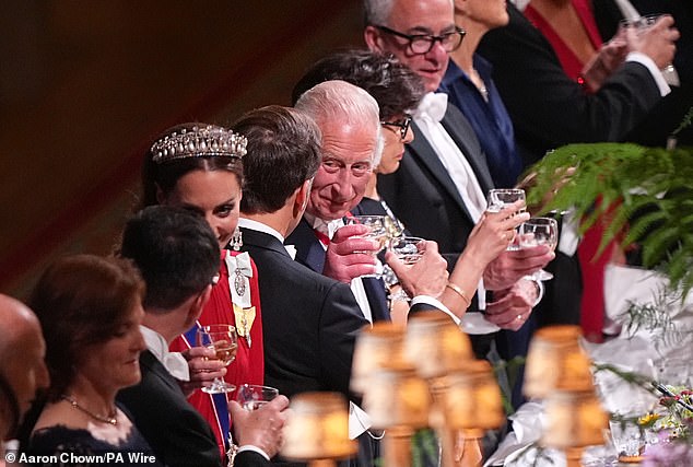 The King beamed as he toasted Macron at the state banquet, hosted at Windsor Castle