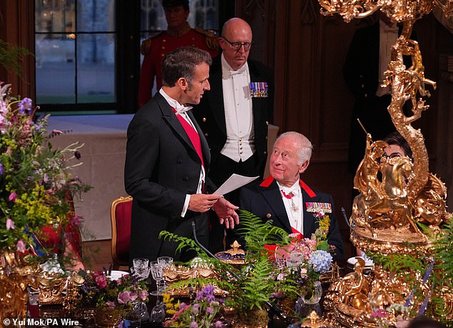King Charles was all smiles as he chatted with President Macron at the state banquet
