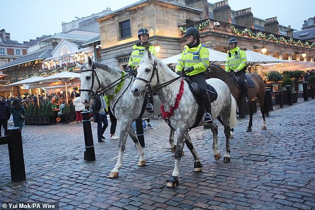 Police officers on horseback in the Covent Garden area of London in December 2024