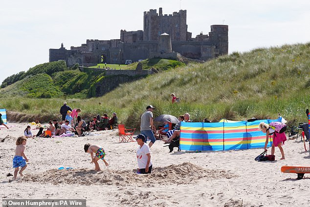 Scenes such as this, at Bamburgh Beach in Northumberland, may be a fond memory for many people