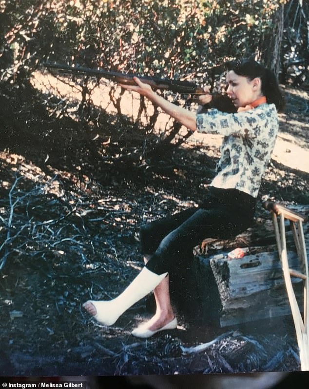 She shared an image of her biological mom Kathy, who was a former exotic dancer, holding a gun