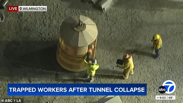 By 9pm, a handful of construction workers were seen being hoisted from a crane to the surface