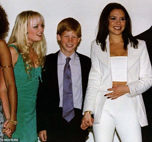 Harry holds hands with Victoria Beckham at a Spice Girls concert in South Africa in 1997