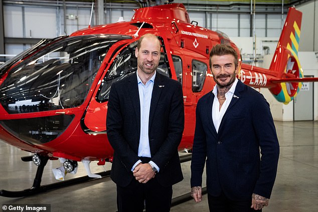 William is pictured with Beckham in front of one of the new London Air Ambulance Charity helicopters at RAF Northolt in October 2024