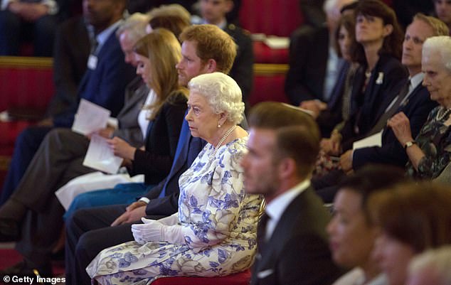 (Left to right) Princess Beatrice, Harry, Queen Elizabeth II and David at a reception for the Queen's Young Leaders Awards at Buckingham Palace in June 2016