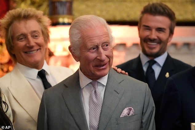 Charles smiles as he attends the King's Foundation charity awards in June 2024 with Rod Stewart, left, and Beckham in the background