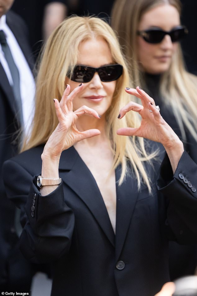 The Hollywood star also bared her chest in a risqué low-cut suit jacket and matching trousers