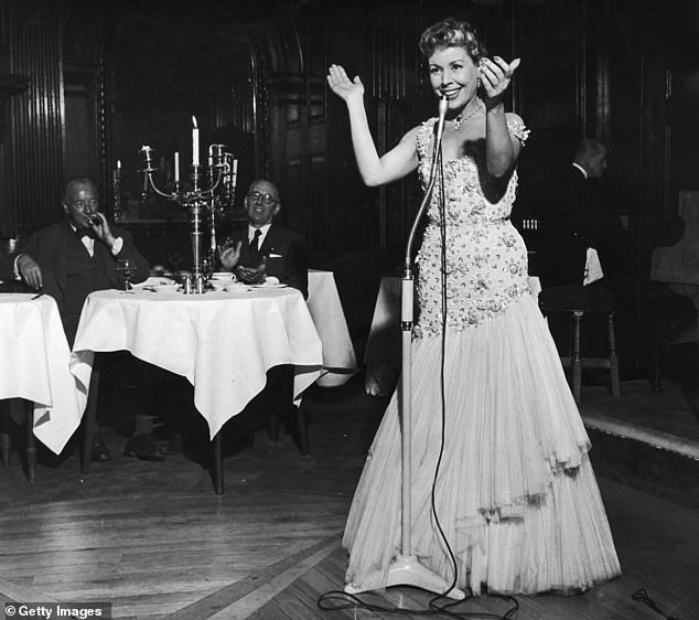 French cabaret singer Helene Cordet  performed for guests at the London club she owned in 1956 where she performed most nights