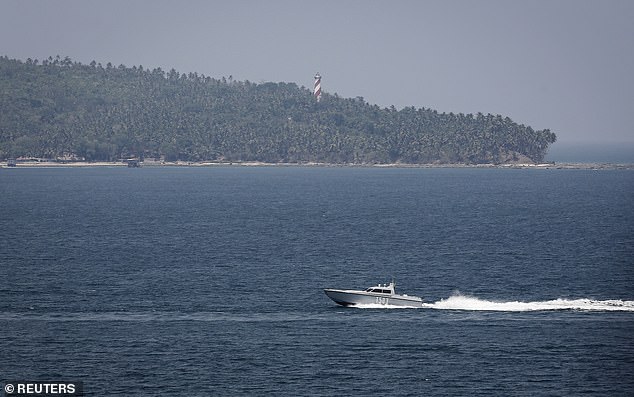 Pictured: An Indian Navy boat patrols in the waters of the Andaman Sea near Port Blair, the capital of India's Andaman and Nicobar islands, March 16, 2014