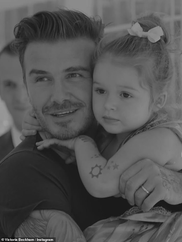 She shared a heartwarming black and white snap of David cradling her