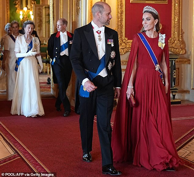 Prince William arrives in white tie rather than the Windsor uniform with Catherine, Princess of Wales. Behind, Anne, Princess Royal, and Prince Edward with red lapels