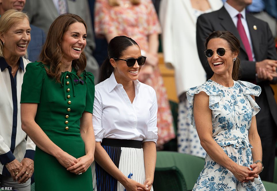 Meghan Markle enjoys a laugh with Kate Middleton and her sister Pippa in the Royal Box at Wimbledon, July 2019