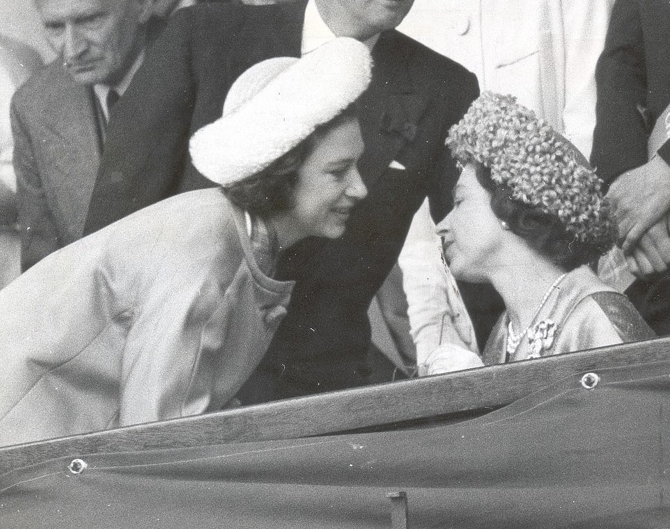 Princess Margaret and the Queen enjoy a sisterly moment in the Royal Box at Wimbledon, July 7, 1962