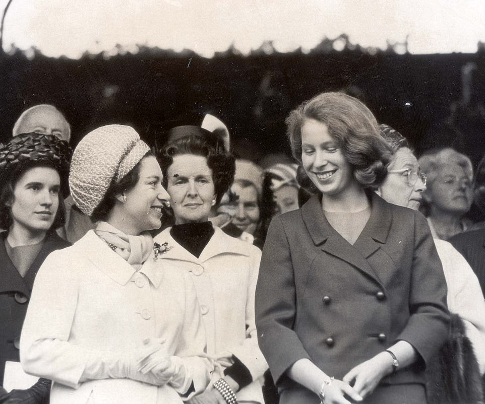 Princess Margaret turns to say a few words to her neice Princess Anne in the Royal Box on the Centre Court at Wimbledon, 1965
