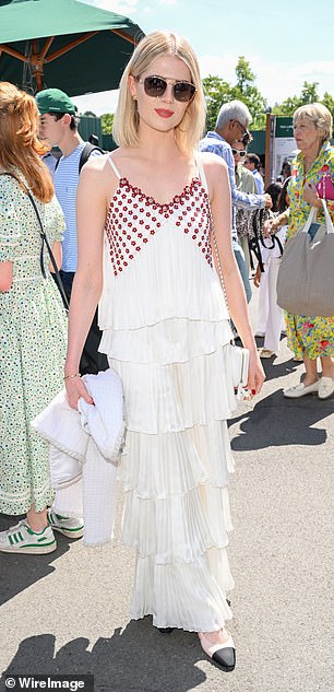 Lucy Boynton (pictured) opted for white as she slipped into a layered sleeveless dress with a v-neckline