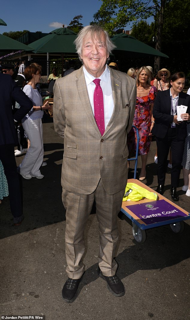 Stephen Fry looked dapper in a brown blazer and trousers which he wore with a crisp whiite shirt and fuchsia tie