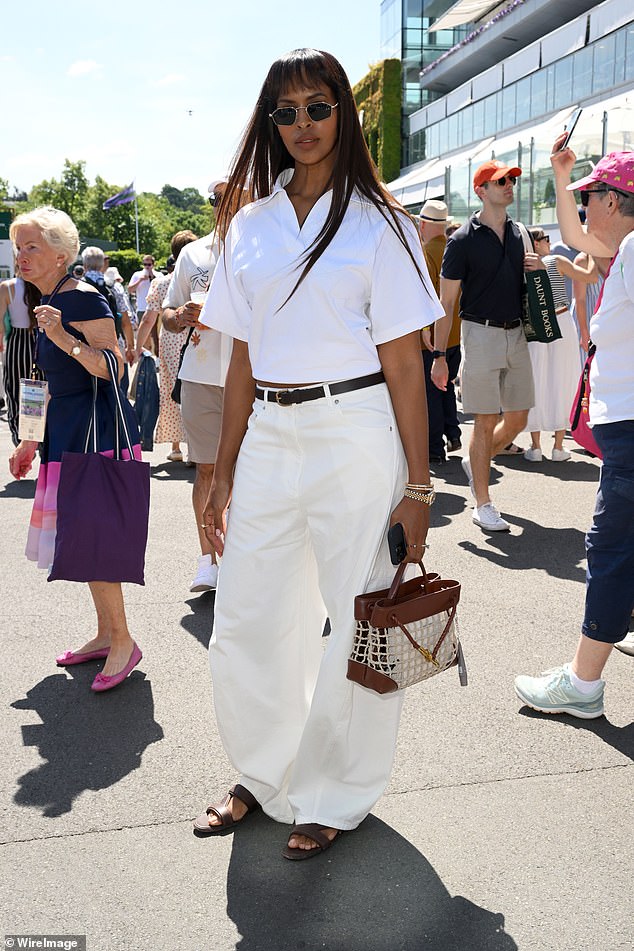 Sabrina Elba opted for a casual look in a white short-sleeved shirt along with a pair of cream trousers