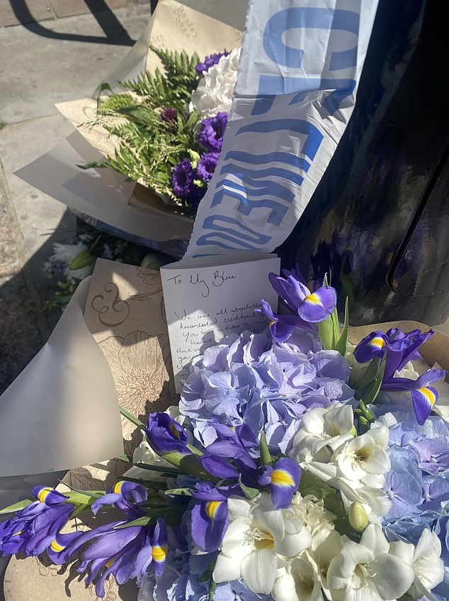 His partner left flowers at the scene of his murder today and said: 'We are absolutely devastated without you. You took a piece of my heart with you. A part of me has gone with you'