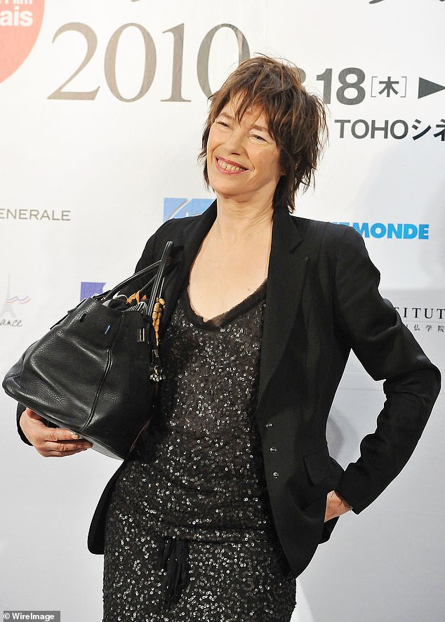 Actress Jane Barkin holds her Hermes Birkin handbag during the France Film Festival 2010 press conference