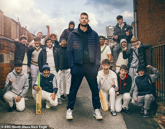 Pictured to the left of Freddie is Umar with his hands in his pockets wearing a white polo top and a black puffer jacket