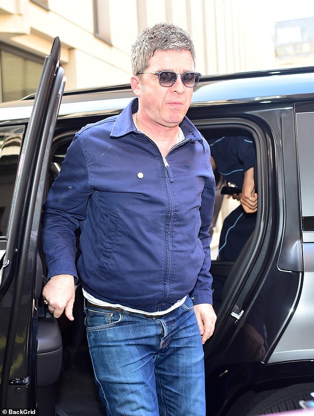 The iconic songwriter, 58, struggled to muster up a smile as he left a blacked out motor in the city centre