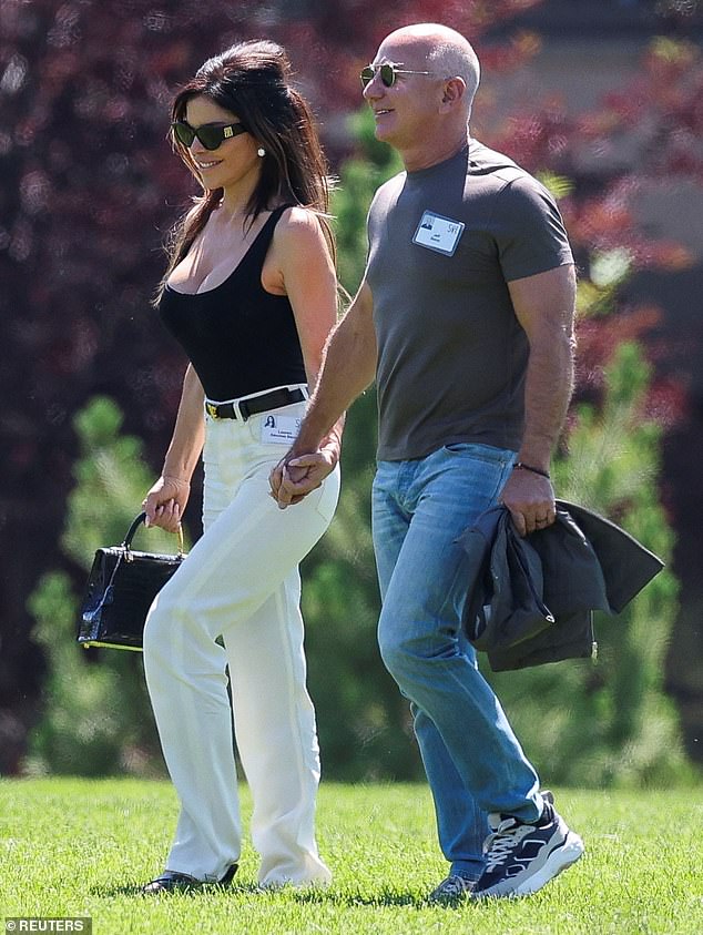 Sanchez put on a busty display in a black scoop neck tank top - that enhanced her ample assets - which she paired with white pants and a simple black belt