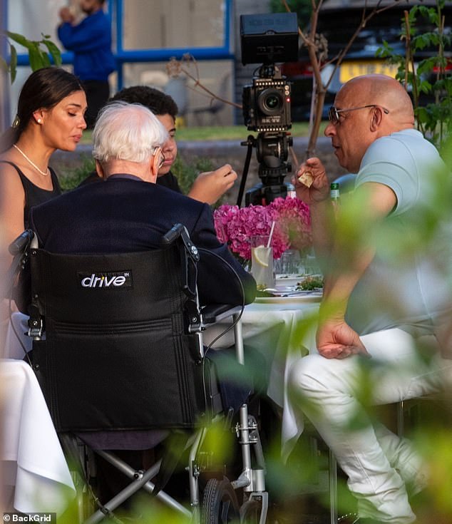 A camera could be seen set up on a tripod near the table