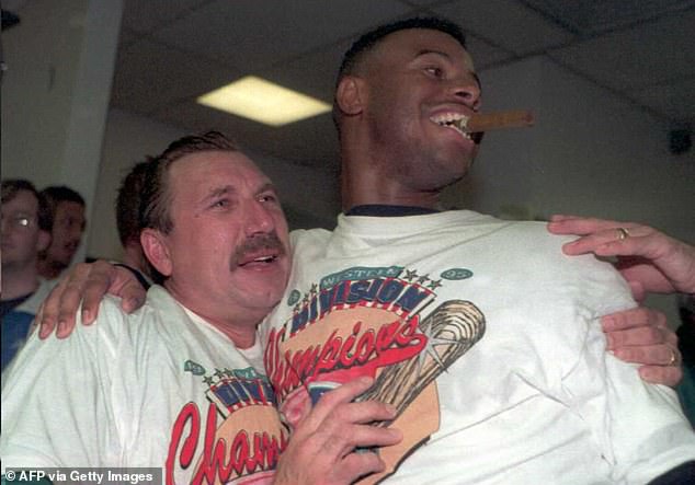 Elia celebrates with Ken Griffey Jr in the locker room after the Mariners won the AL West in 97