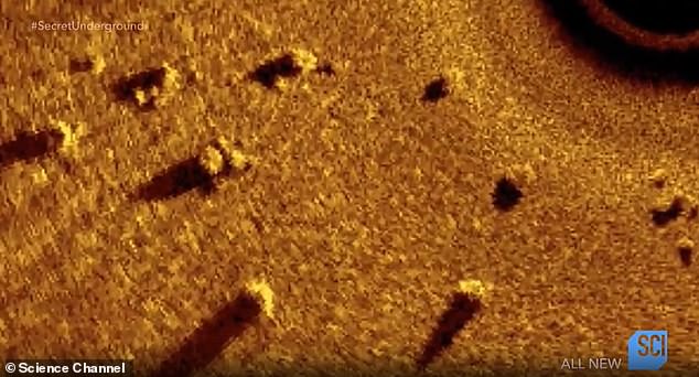 Discovered in 2007, the 9,000-year-old site lies 40 feet below the surface of Grand Traverse Bay and features large stones arranged in a line culminating in a hexagon, near a boulder bearing what was long suspected to be an animal carving