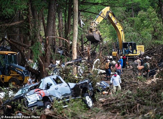 In the early morning hours of July 4, catastrophic flooding struck the region as the river surged 26 feet in just 45 minutes - swallowing homes, roads and entire campgrounds with little warning (pictured: rescue operations)