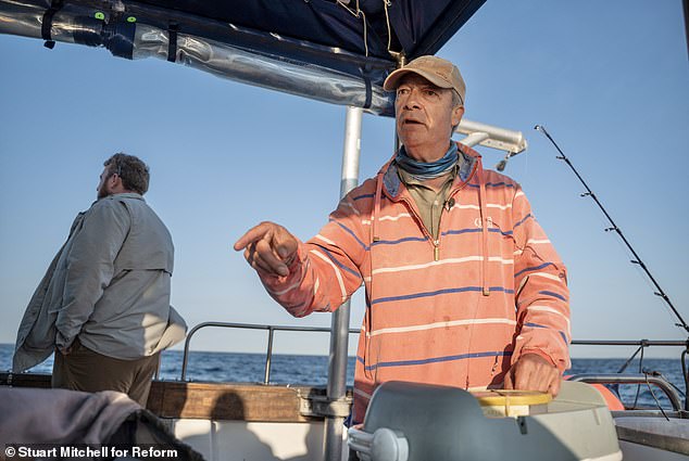 Earlier yesterday, Mr Farage watched from a boat as 78 migrants were unloaded from a dinghy to the Border Force catamaran Hurricane in the middle of the Channel
