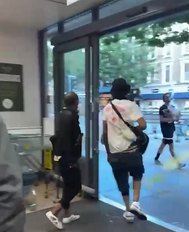 Footage shows the two thieves strolling out of the Waitrose store in Notting Hill Gate with the stolen goods at around 8.30pm before cycling off