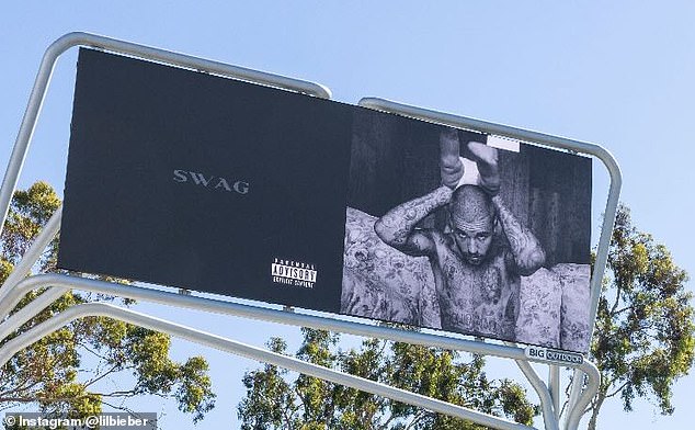 The billboards - which have been seen from Los Angeles to Iceland - which feature the potential name also include a black and white photo of a shirtless Justin who is holding son Jack Blues Bieber, 10 months, over his head as the toddlers legs hung up in the air