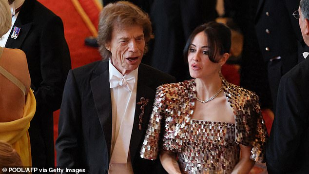 Mick Jagger, pictured with his fiancee Melanie Hamrick, looked like a dishevelled footman who¿d been knocking back bottles in le sherry cupboard at this week's state banquet