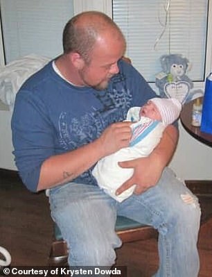 Brock was also photographed cradling Dowda's first child, Braxton, on the day he was born in 2011