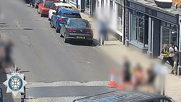 CCTV footage captured the moment the hero cop tussled with the knifeman in the street