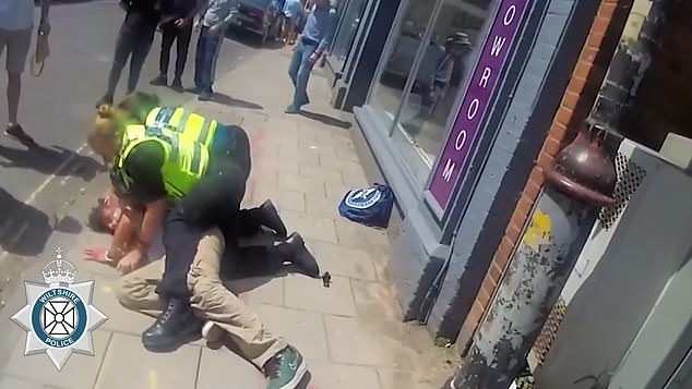 She managed to tackle the man and restrain him on the ground