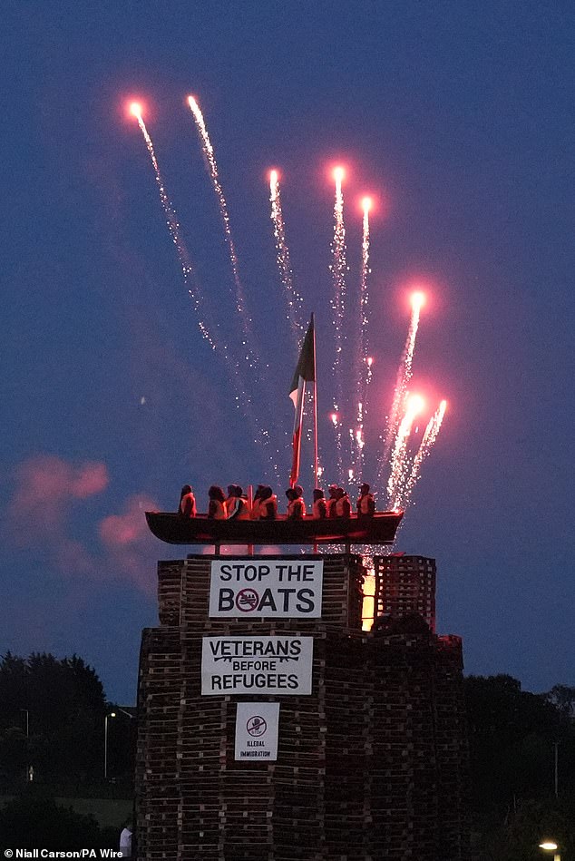 Signs saying 'Stop the boats' and 'Veterans before refugees' were also attached to the pyre in the village of Moygashel, near Dungannon, County Tyrone, earlier this week
