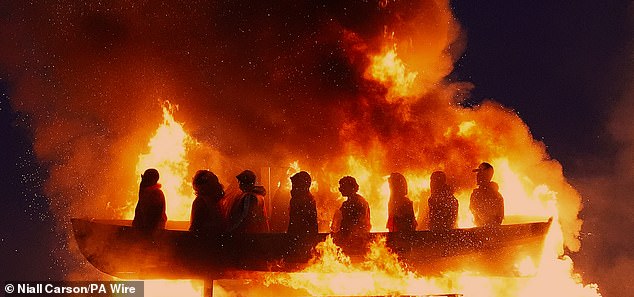 Mr Gildernew said the effigy was 'a clear incitement to hatred and must be removed immediately' before it was set ablaze