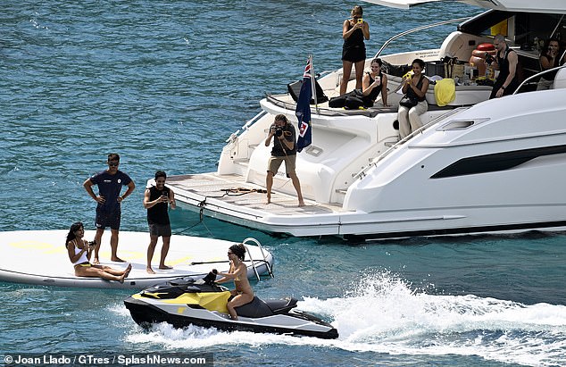 The crew all assumed their positions on the boat as they took their shots of Hailey