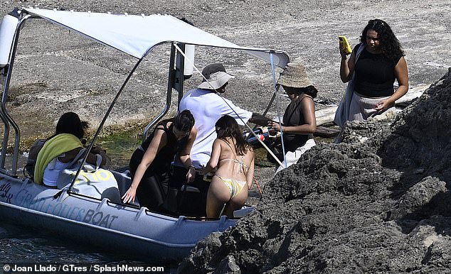Hailey and the crew were seen squeezing onto a dingy boat as they were taken back to shore