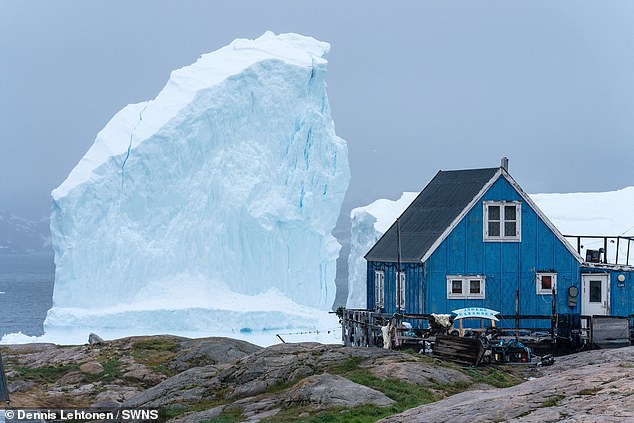 One local said of the town's reaction to the icebergs: 'Some say they're worried, but there are plenty of people who are sort or excited (like me)'