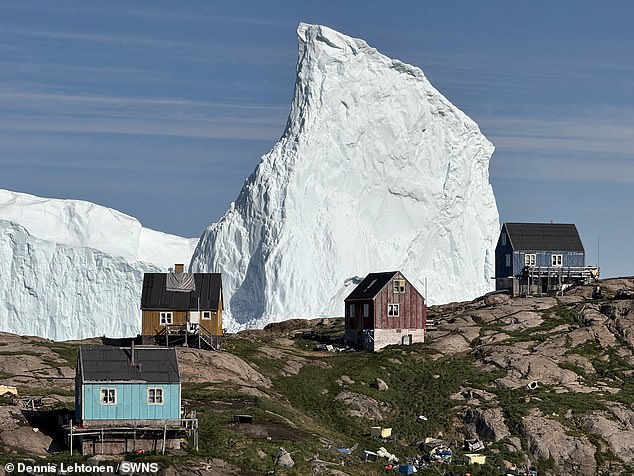 The towering structure has been edging closer to a harbour in Innaarsuit, where local authorities have issued warnings to the public