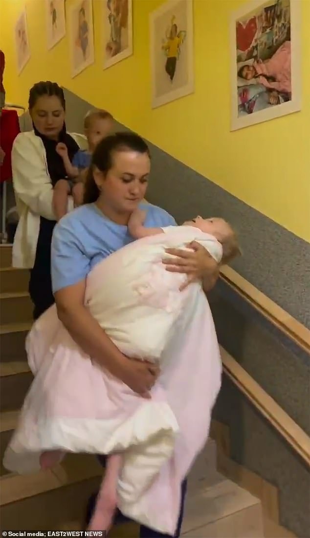 Heartbreaking scenes show the forced evacuation from a hospice for seriously ill orphans - due to Vladimir Putin 's relentless drone strikes targeting civilians